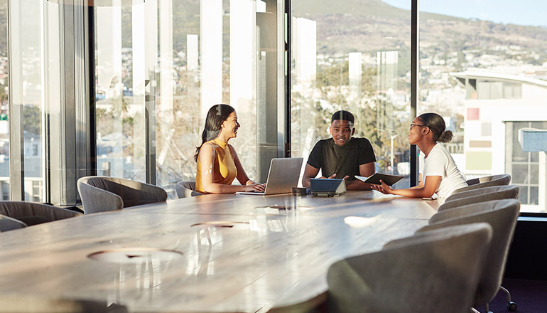 Business and technology leaders collaborating in a meeting
